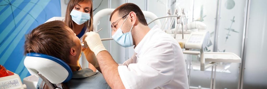 Patient receiving a dental checkup at Dr. Imran Dental Care Clinic in Pakistan